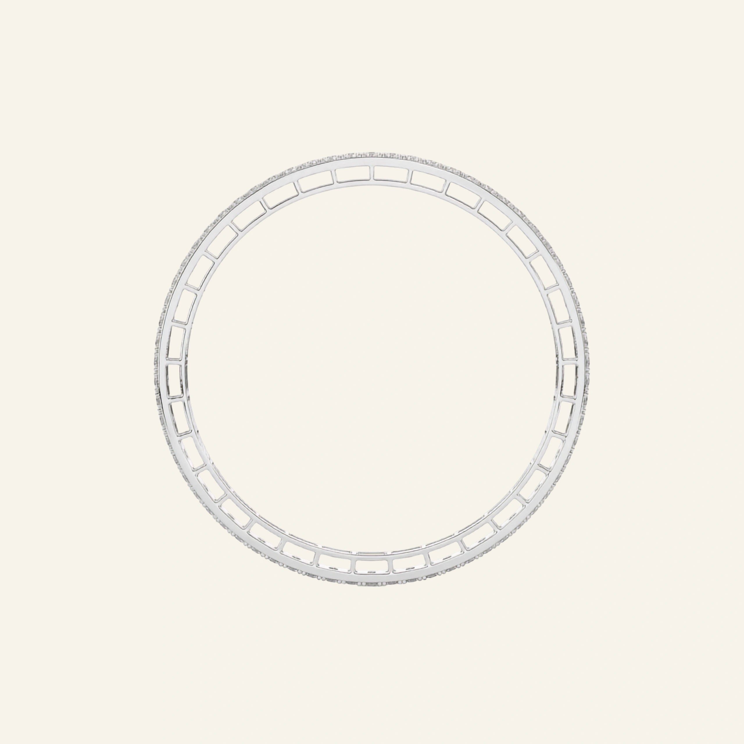 A white gold bangle bracelet from the side angle featuring a continuous row of small clear stones along one side, displayed on a light cream background showing the geometric pattern. 